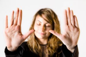 Beauty woman showing her hand palms. Selective focus.